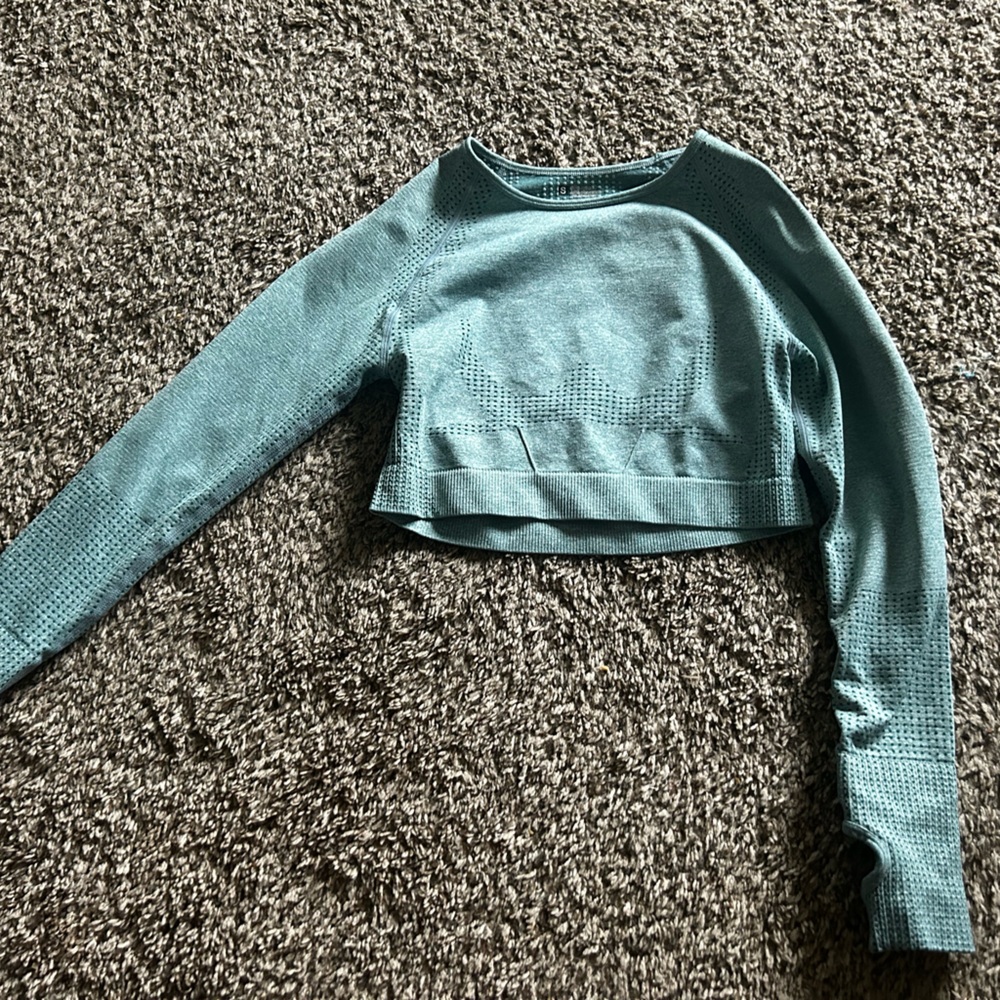 Light teal workout cropped top.